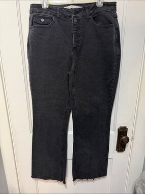 High-Rise Button-Front Black Jeans — wide leg/raw hem